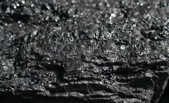 The surface of a natural black hard coal or diamond coal