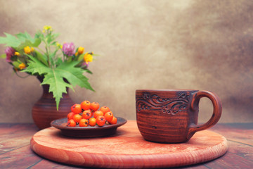 Autumn bouquet of wildflowers in a clay ceramic jug