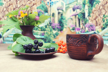 Autumn bouquet of wildflowers in a clay ceramic jug