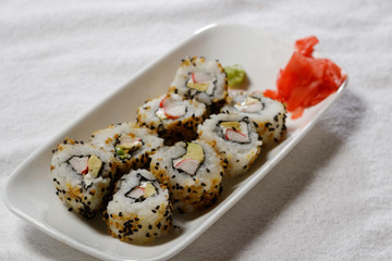Sushi is traditionally made with medium-grain white rice. It is very often prepared with seafood, such as squid, eel, yellowtail, salmon, tuna or imitation crab meat.