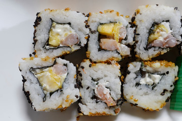Sushi is traditionally made with medium-grain white rice. It is very often prepared with seafood, such as squid, eel, yellowtail, salmon, tuna or imitation crab meat.