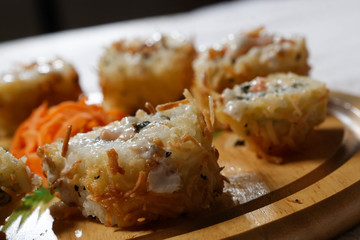 Sushi is traditionally made with medium-grain white rice. It is very often prepared with seafood, such as squid, eel, yellowtail, salmon, tuna or imitation crab meat.