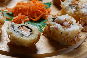 Sushi is traditionally made with medium-grain white rice. It is very often prepared with seafood, such as squid, eel, yellowtail, salmon, tuna or imitation crab meat.