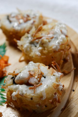 Sushi is traditionally made with medium-grain white rice. It is very often prepared with seafood, such as squid, eel, yellowtail, salmon, tuna or imitation crab meat.