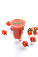 homemade tomato juice in a glass and fresh tomatoes