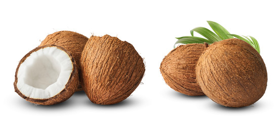 Set with Fresh raw coconut with palm leaves isolated on white background.