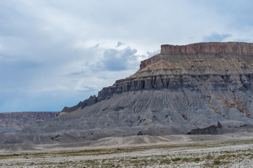 Landscape of blue, grey and yellow barren hills near Hanksville, Utah