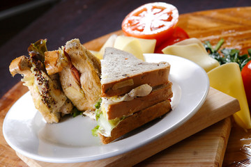 A sandwich club, also called a clubhouse sandwich, is a sandwich of bread, sliced ​​cooked poultry, or fried bacon, lettuce, tomato, and mayonnaise.