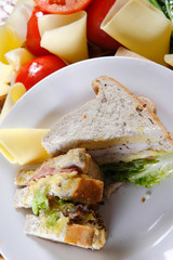 A sandwich club, also called a clubhouse sandwich, is a sandwich of bread, sliced ​​cooked poultry, or fried bacon, lettuce, tomato, and mayonnaise.
