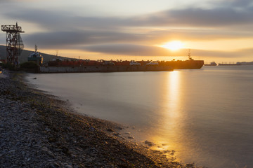 Fototapeta na wymiar Vladivostok, Russia. Sunset overlooking the pier by the sea.