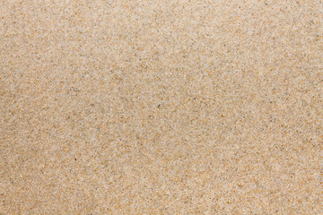 Fototapeta na wymiar Texture quartz sand closeup. Sand on beach.