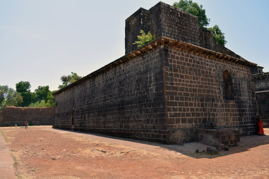 stock photo of  popular ancient fort near kolhapur city, Panhala fort . exterior view of amberkhana ganga kothi, which was used for food storage or warehouse.Picture captured under bright sunlight.
