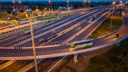 Fototapeta na wymiar aerial view traffic car transportation freeway motorway and ring road at twilight