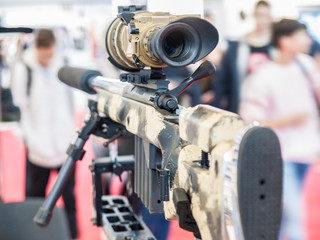Rifle with a telescopic sight and stand