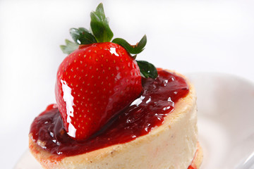 Cheese pie with strawberries and walnut.