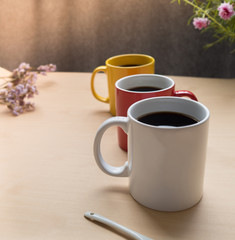 Three coffee cup focus on white cup