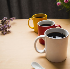 Three coffee cup focus on white cup