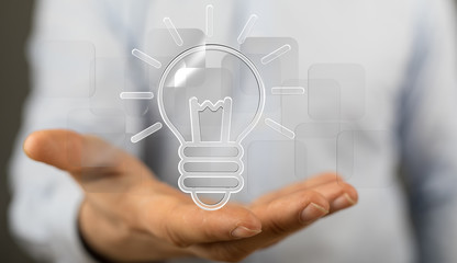  holding illuminated light bulb, idea, innovation and inspiration concept.