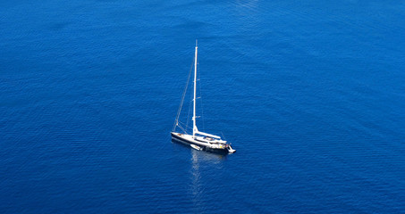 aerial view of boat in the sea and blue water