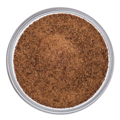 Coconut blossom sugar in glass bowl isolated on white background, top view