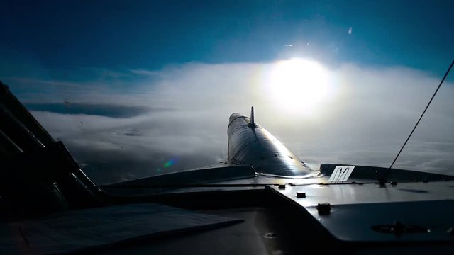 The plane flies through the clouds