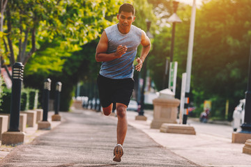 people runner running on running road in city park