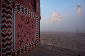Taj Mahal in the fog at Indian city of Agra, Uttar Pradesh, India.
