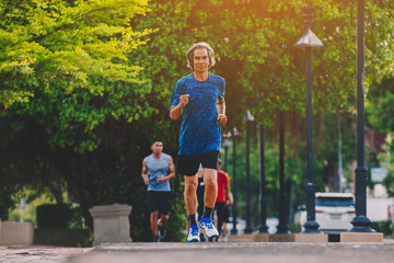 people runner running on running road in city park