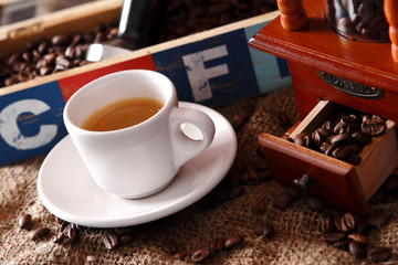 Coffee with grains and sweet bread. Coffee is a brewed drink prepared from roasted coffee beans, the seeds of berries from certain Coffea species.