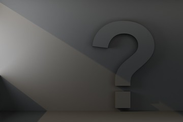 question mark on a wall with ray of light