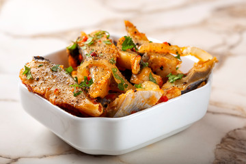Marinated hering fish with spices and herbs