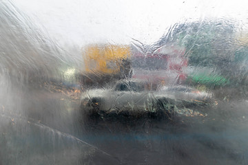 Abstract of Water drops on a plastic, Have a car in the background