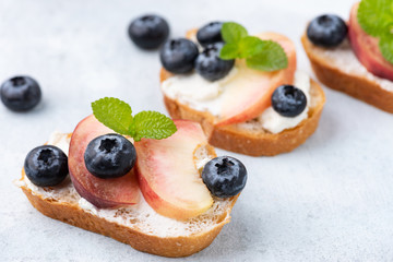 bread toast with peach and blue berry