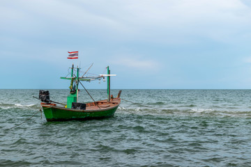 Naklejka na ściany i meble Small fishing boats parked on the beach.