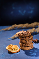 Biscuits on the dark blue background. Cookies in pile.