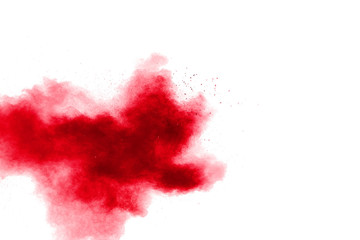 Abstract red powder explosion on white background. Red powder explosion.Freeze motion of red dust...