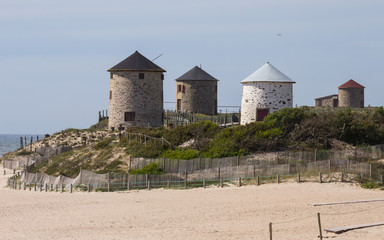Ancient Windmills in Apulia Beach, Portugal.