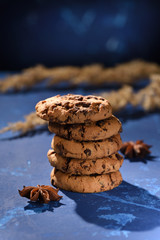Biscuits on the dark blue background. Cookies in pile.