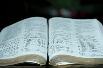 Close up of open Holy Bible in Psalm 121. Blurred background. Horizontal shot.