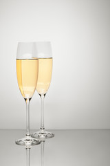 Two glasses of champagne isolated on white background