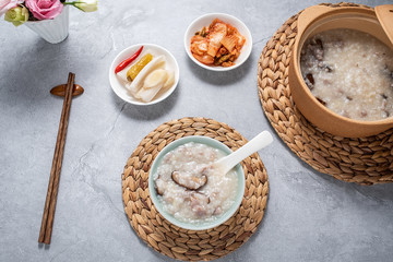 A bowl of shiitake mushroom lean porridge and sour cabbage sour radish