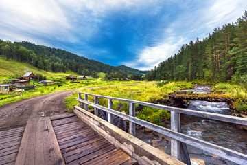 Fototapeta premium The bridge on the river Kuyum. Gorny Altai, Siberia, Russia