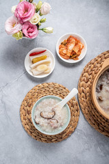 A bowl of shiitake mushroom lean porridge and sour cabbage sour radish