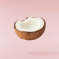 Fresh ripe coconut isolated on pink background