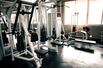 Within gym with modern fitness equipment.