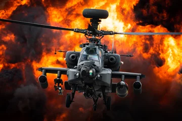Selbstklebende Fototapete Hubschrauber Ein AH-64 Apache Kampfhubschrauber vor einer großen Explosion.