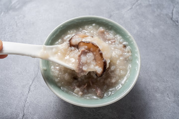 A bowl of nutritious and delicious mushroom lean meat porridge