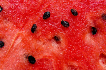 flat lay food.close up inside of watermelon, red surface with black seeds have copy space for put text.