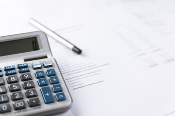 Calculator placed on accounting documents