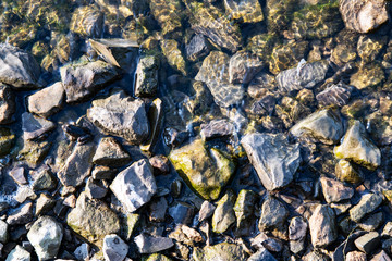 sharp stones in the water by the river
